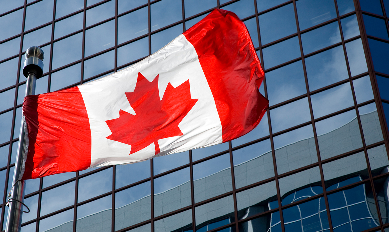 Canadian flag in front of a building