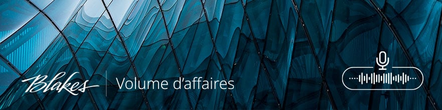 Bannière web Volume d'affaires, comportant le texte « Volume d'affaires » avec une image abstraite de la fenêtre d'un bâtiment d'entreprise.